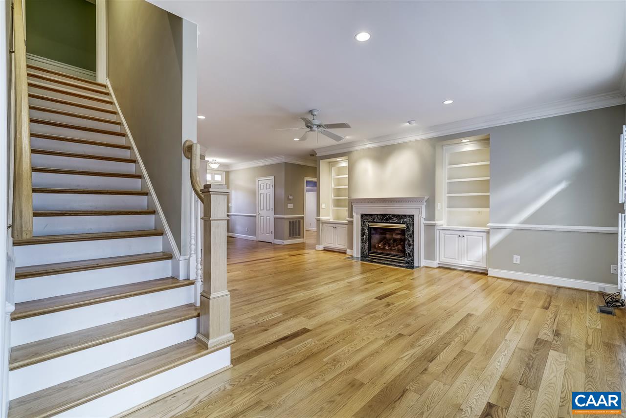 3398 Darby Road Keswick, VA 22947 - Photo 11 of 50 a view of a hallway with wooden floor fireplace and a window