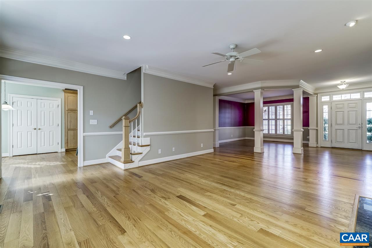 3398 Darby Road Keswick, VA 22947 - Photo 12 of 50 a view of a room with wooden floor staircase and a kitchen