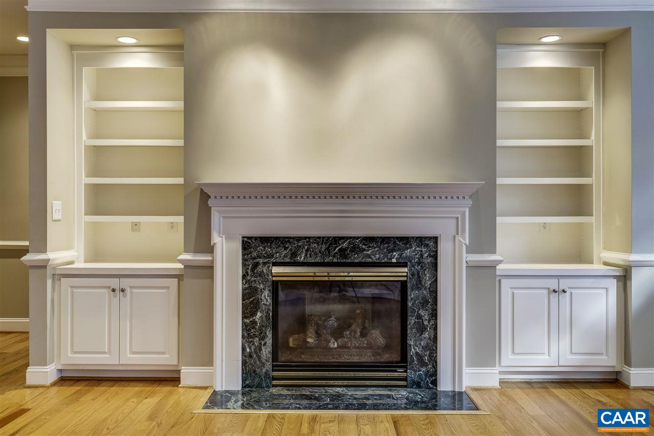 3398 Darby Road Keswick, VA 22947 - Photo 13 of 50 a living room with a fireplace and a table