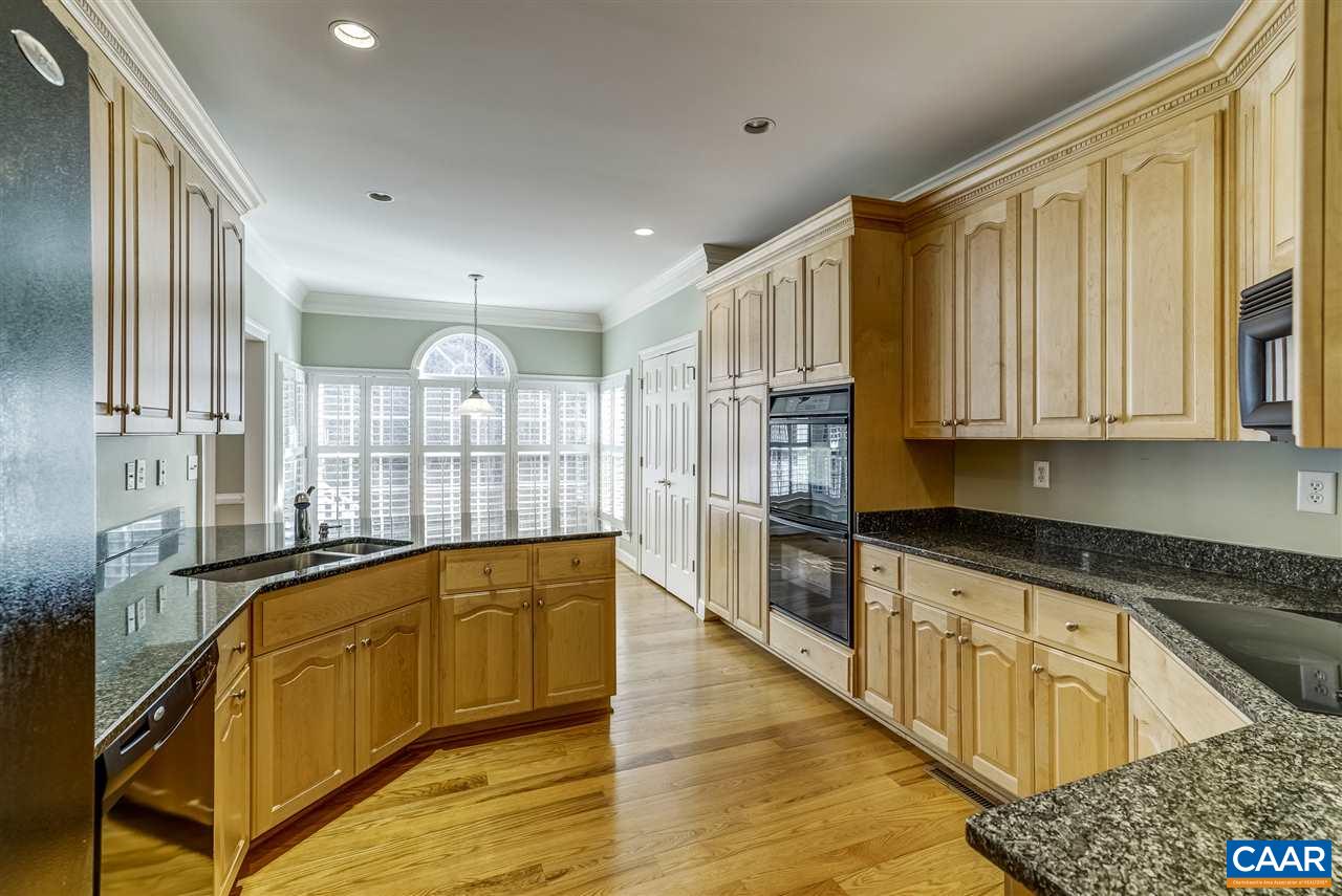 3398 Darby Road Keswick, VA 22947 - Photo 15 of 50 a view of a kitchen with wooden floor and iron stairs
