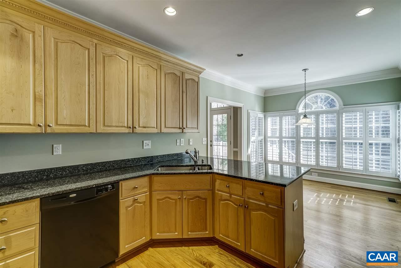 3398 Darby Road Keswick, VA 22947 - Photo 16 of 50 a open kitchen with granite countertop a sink dishwasher stove and cabinets with wooden floor