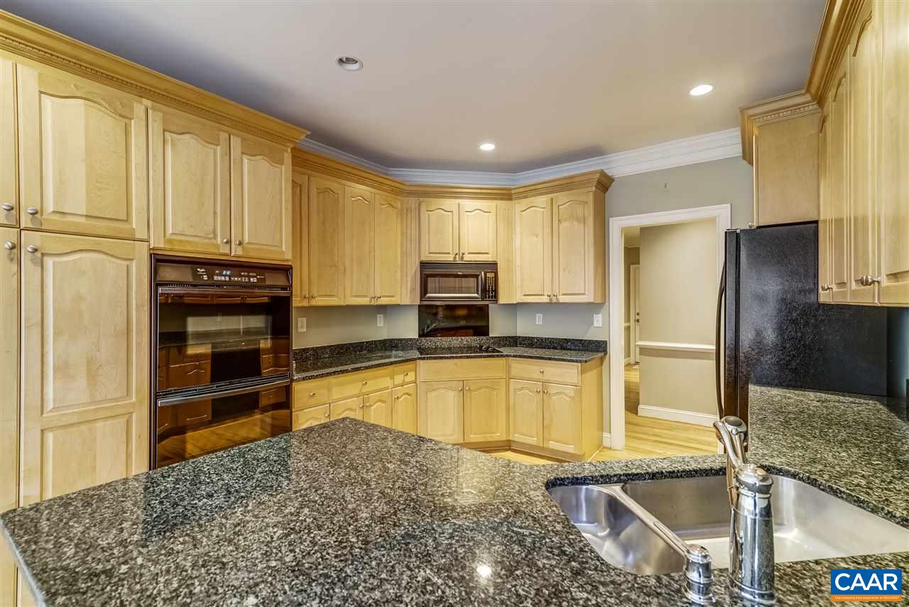 3398 Darby Road Keswick, VA 22947 - Photo 18 of 50 a kitchen with stainless steel appliances granite countertop a refrigerator and a stove top oven