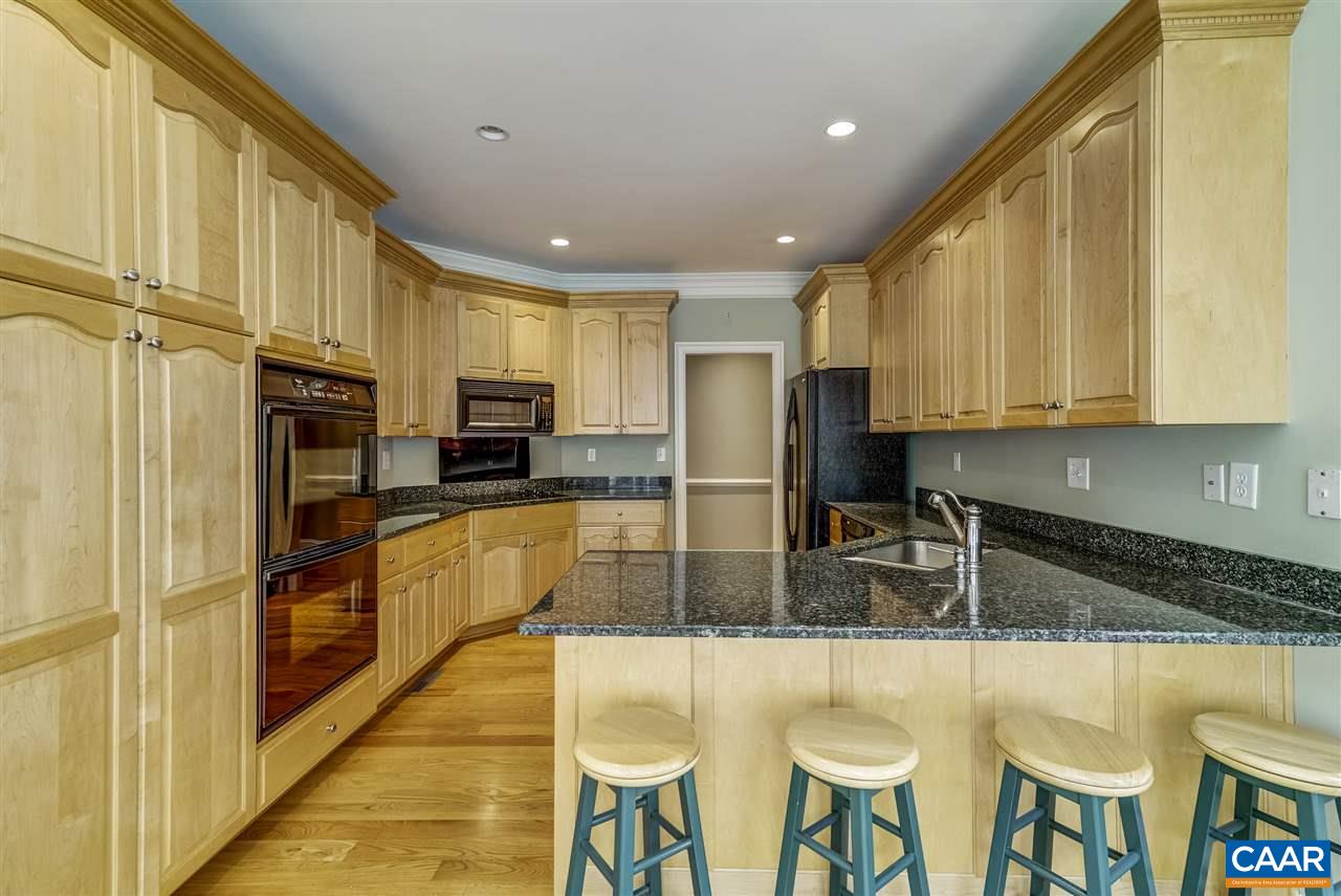 3398 Darby Road Keswick, VA 22947 - Photo 23 of 50 a kitchen with stainless steel appliances granite countertop a stove a sink a microwave a refrigerator and cabinets