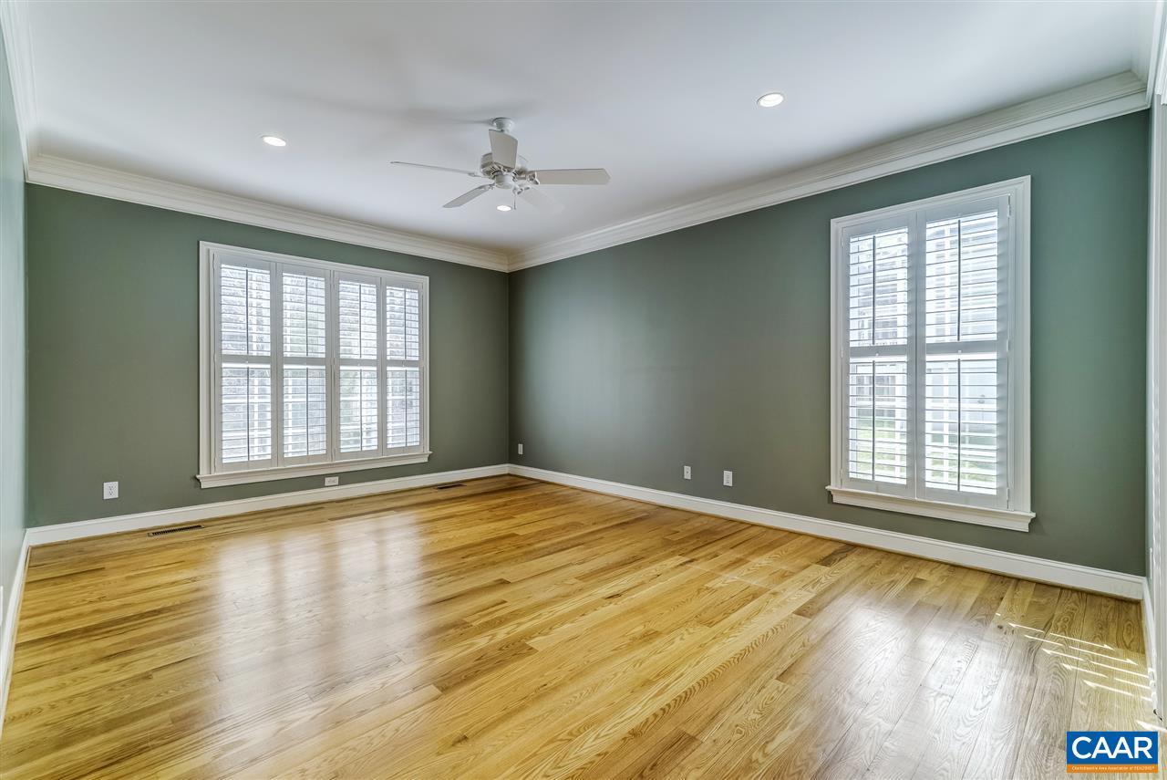 3398 Darby Road Keswick, VA 22947 - Photo 24 of 50 a view of an empty room with wooden floor and a window