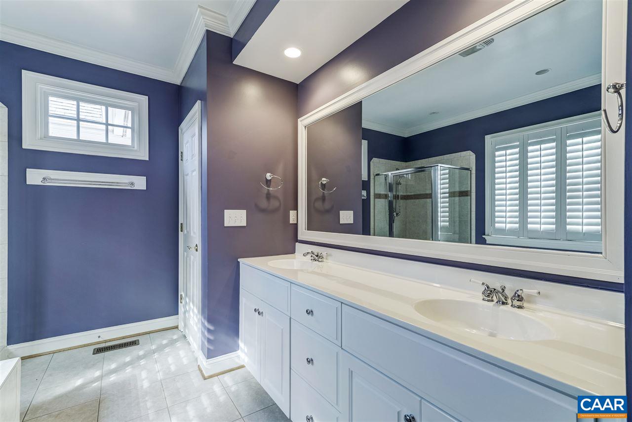 3398 Darby Road Keswick, VA 22947 - Photo 29 of 50 a spacious bathroom with a granite countertop sink and a large mirror