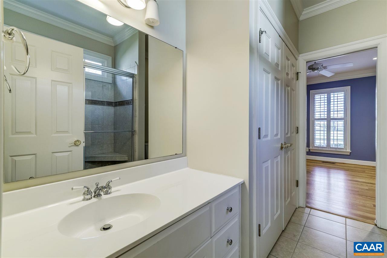3398 Darby Road Keswick, VA 22947 - Photo 38 of 50 a bathroom with a sink and a mirror