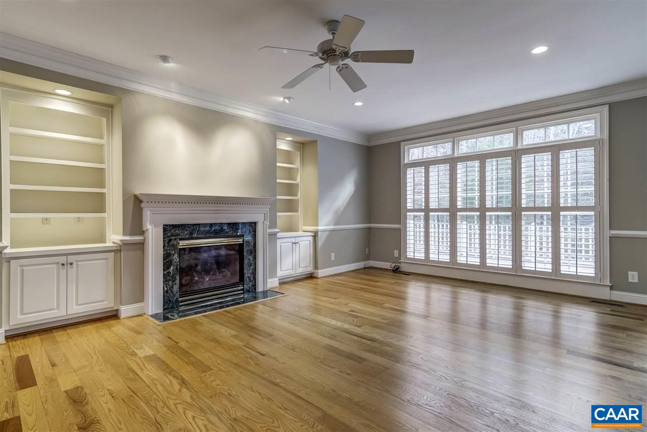 3398 Darby Road Keswick, VA 22947 - Photo 8 of 50 a view of an empty room with a fireplace and a window