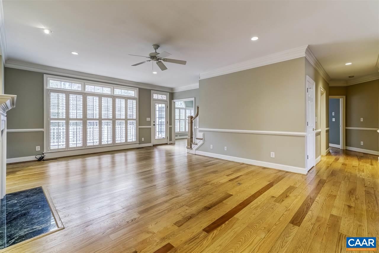 3398 Darby Road Keswick, VA 22947 - Photo 9 of 50 a view of an empty room with wooden floor and a window