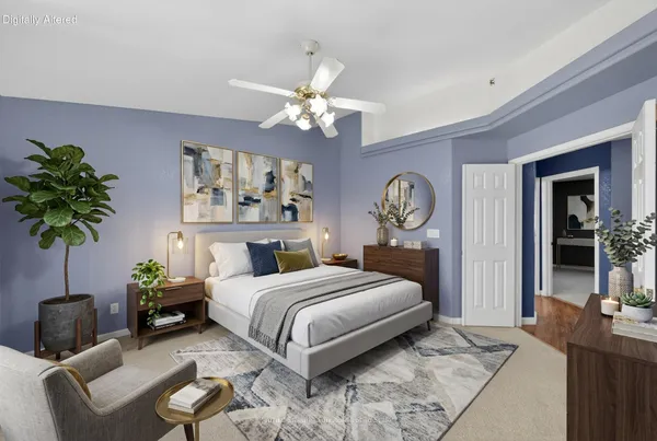 a bedroom with a bed a chandelier and a dresser