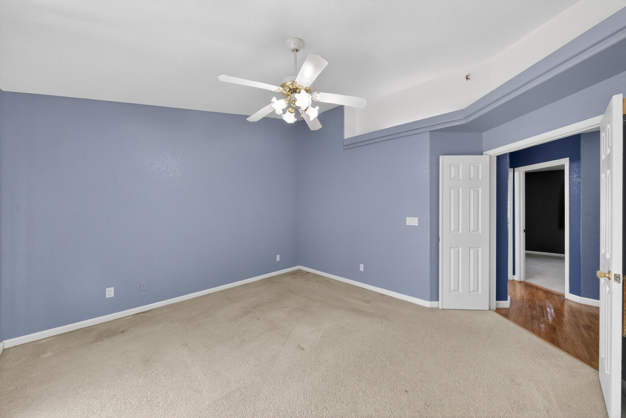 3360 Lawrence Road Redding, CA 96002 - Photo 14 of 43 a view of an empty room with a chandelier fan