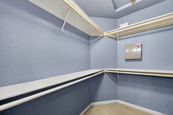 a view of an empty walk in closet
