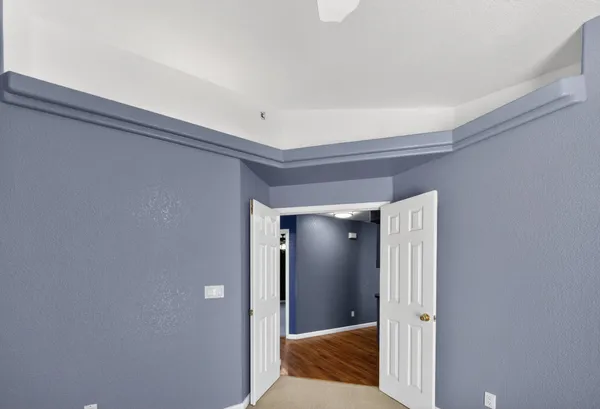 a view of a bedroom from a hallway