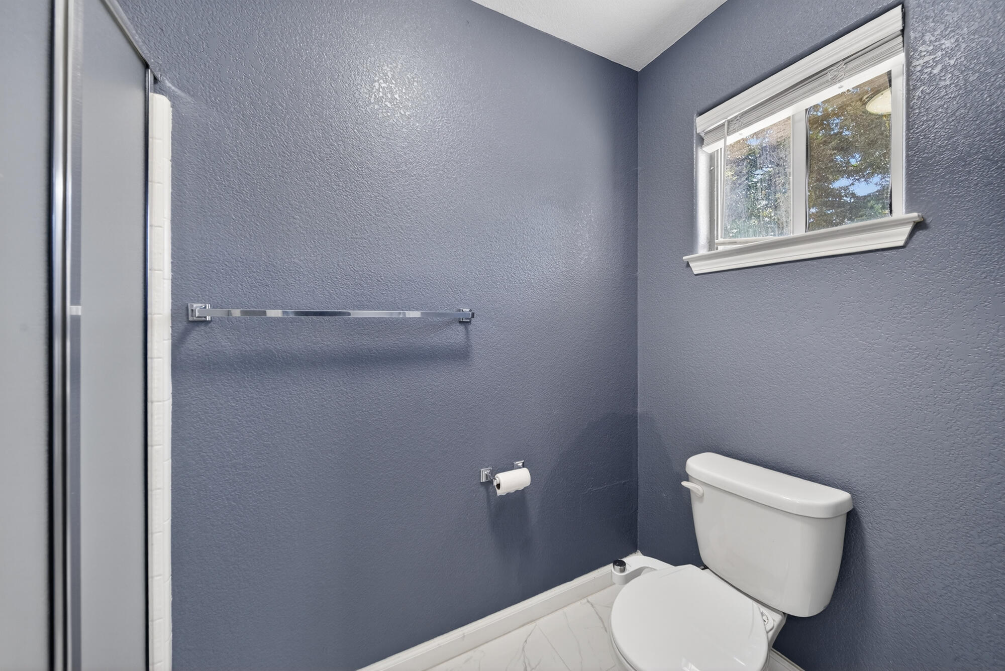 3360 Lawrence Road Redding, CA 96002 - Photo 28 of 43 a white toilet sitting next to a bathroom sink