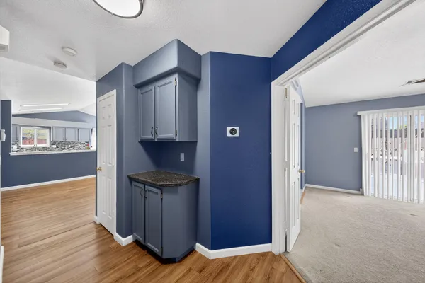 a view of kitchen and wooden floor
