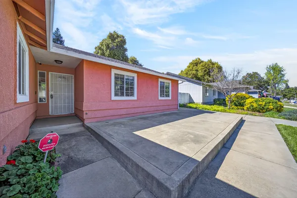 a view of a backyard with a patio