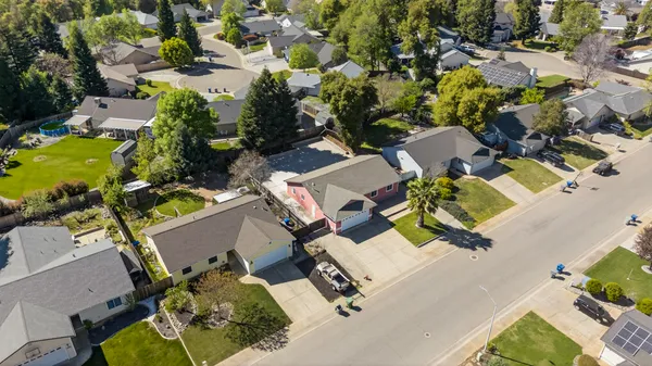 an aerial view of residential house with outdoor space and swimming pool