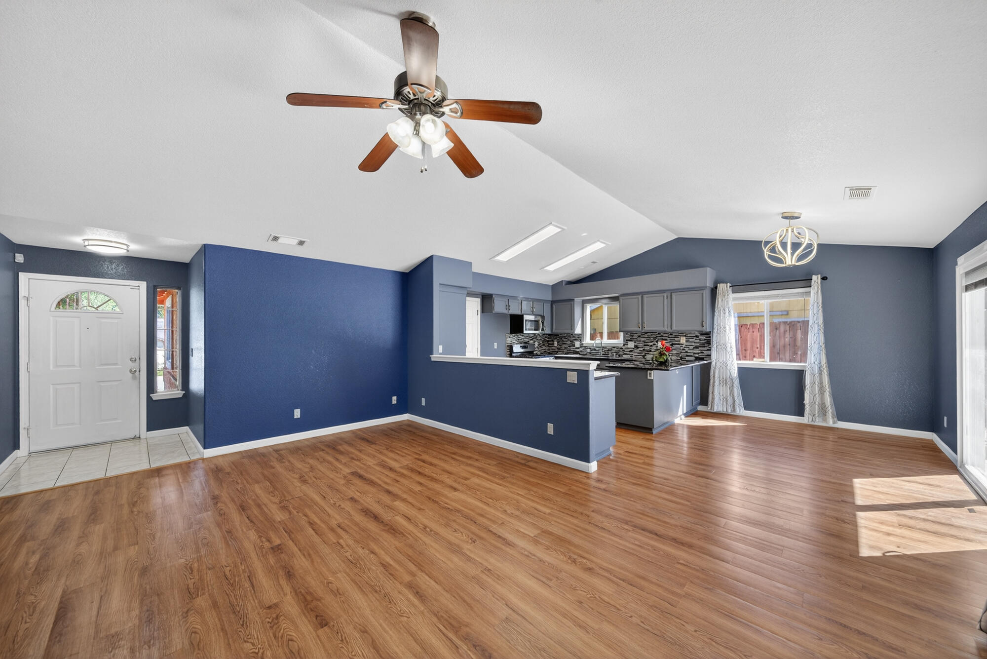 3360 Lawrence Road Redding, CA 96002 - Photo 5 of 43 a bedroom with kitchen ceiling fan and wooden floor