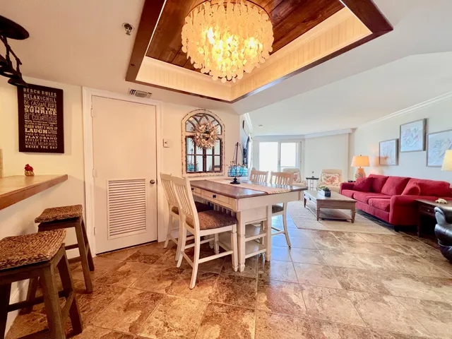 a living room with furniture a dining table and a stove