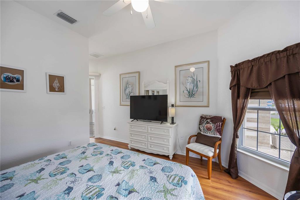 48 Bunker Road Rotonda West, FL 33947 - Photo 39 of 59 a bedroom with a bed and a window
