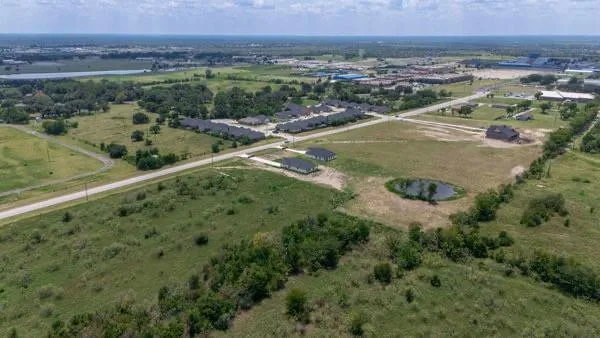 a view of a lake with a yard