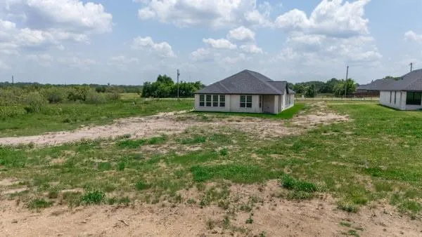 a bathroom with a shower and a sink