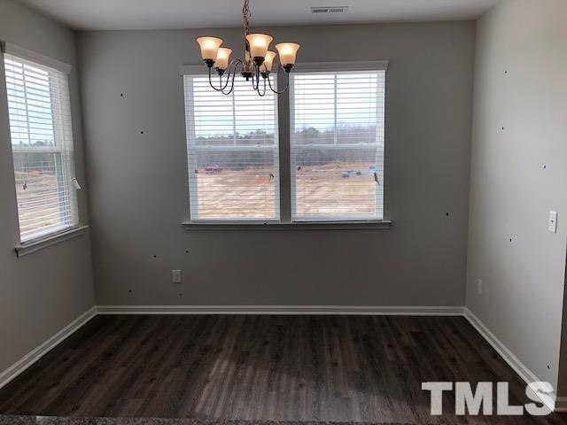307 Devon Clfs Drive Wake Forest, NC 27587 - Photo 5 of 13 a view of wooden floor and window in a room