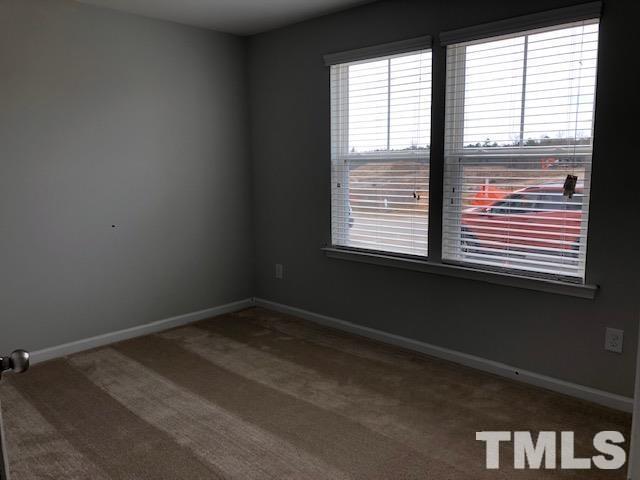 307 Devon Clfs Drive Wake Forest, NC 27587 - Photo 6 of 13 a view of an empty room with a window