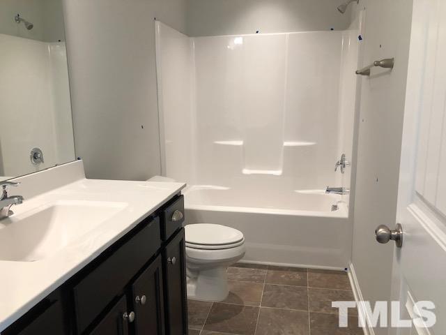 307 Devon Clfs Drive Wake Forest, NC 27587 - Photo 9 of 13 a bathroom with a sink a toilet and shower