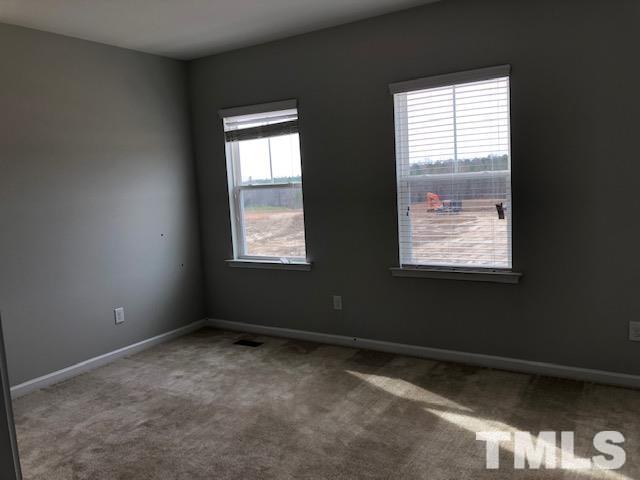 307 Devon Clfs Drive Wake Forest, NC 27587 - Photo 10 of 13 a view of an empty room with a window