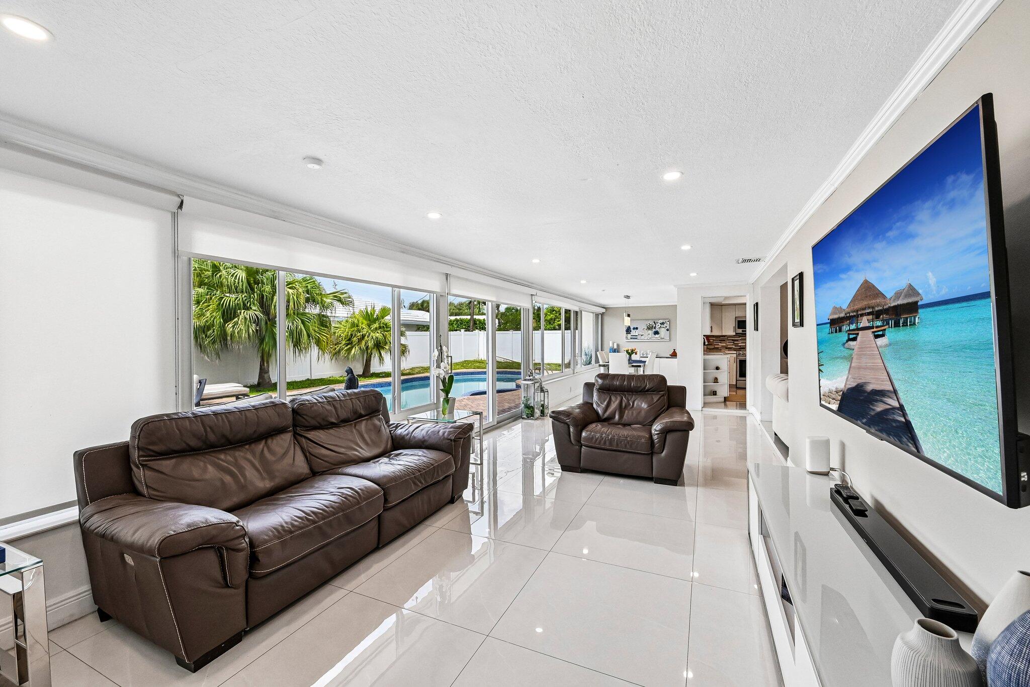 2940 Northeast 39th Court Lighthouse Point, FL 33064 - Photo 15 of 42 a living room with furniture and a flat screen tv