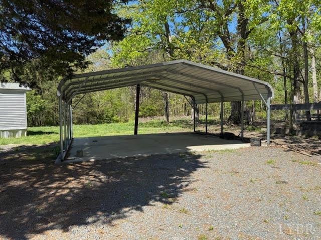 1098 Pamplin Road Pamplin, VA 23958 - Photo 3 of 26 a view of a backyard with a table and chairs under an umbrella