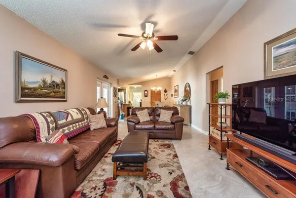 a living room with furniture and flat screen tv
