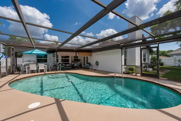 a view of a backyard with sitting area