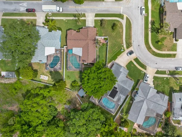 an aerial view of a house with outdoor space swimming pool and outdoor seating