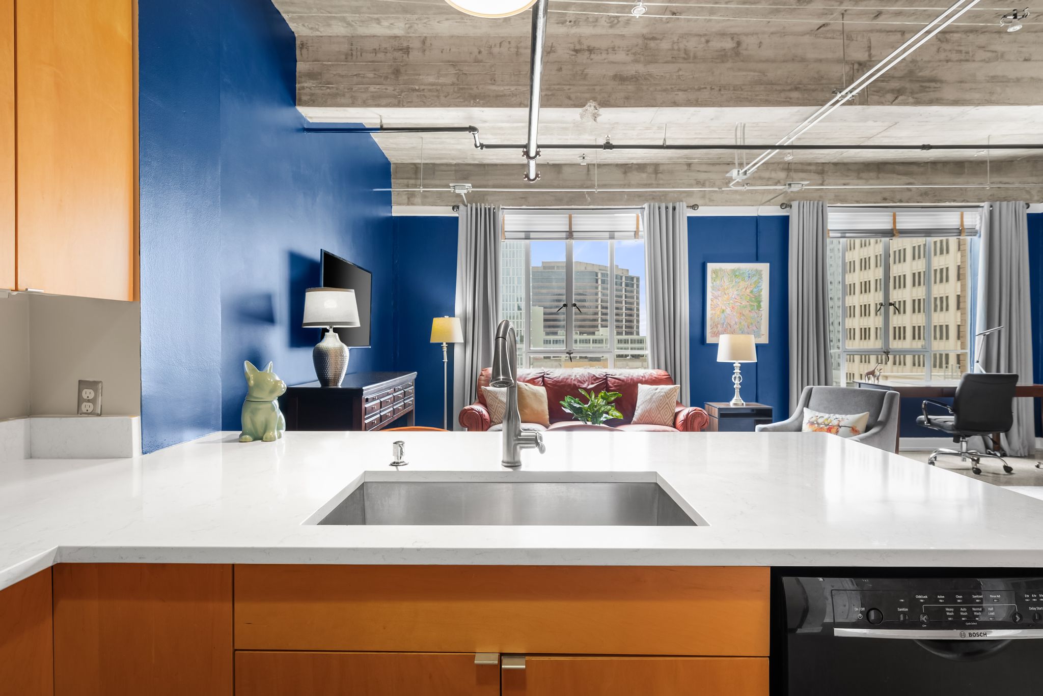 710 Colorado Street, Unit 6E Austin, TX 78701 - Photo 3 of 24 An open concept living space with exposed ductwork and city views.
