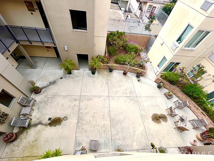 4800 3rd Street, Unit 406 San Francisco, CA 94124 - Photo 2 of 2 a white building with view of outdoor