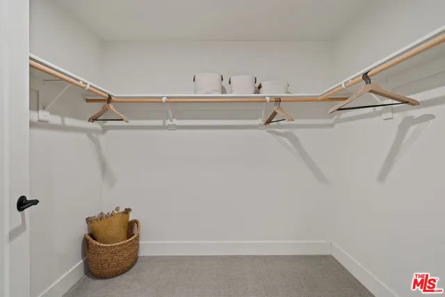 a bathroom with a double vanity sink toilet and shower