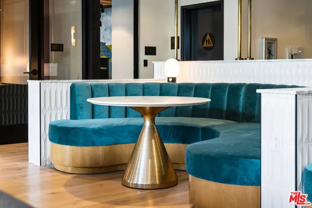 a view of a living room and kitchen