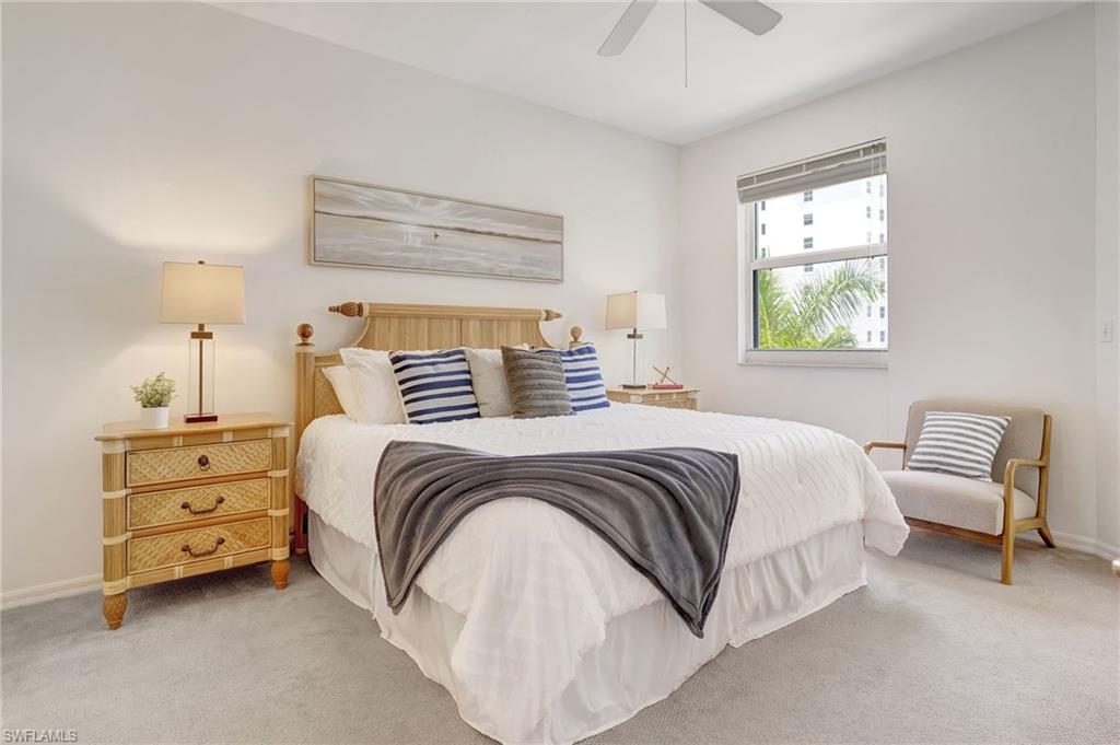 470 Launch Circle, Unit V405 Naples, FL 34108 - Photo 14 of 41 a bedroom with a bed and window