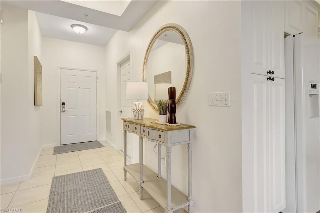 470 Launch Circle, Unit V405 Naples, FL 34108 - Photo 2 of 41 a view of a bathroom with mirror gate