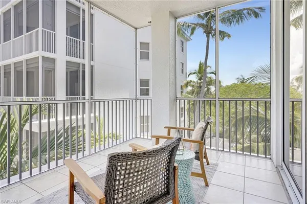 a view of a balcony with chair and the potted plant