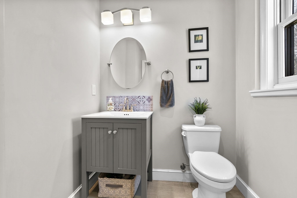 57 Jefferson Road Winchester, MA 01890 - Photo 8 of 42 a bathroom with a toilet a sink and mirror
