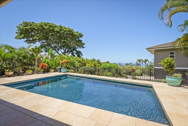 a view of swimming pool from a balcony