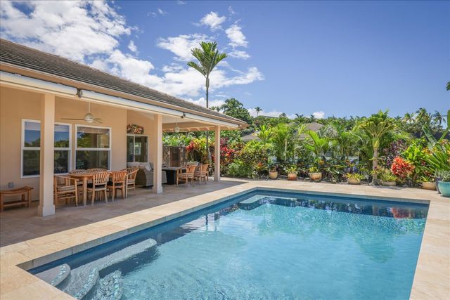 a view of a swimming pool with a lounge chairs