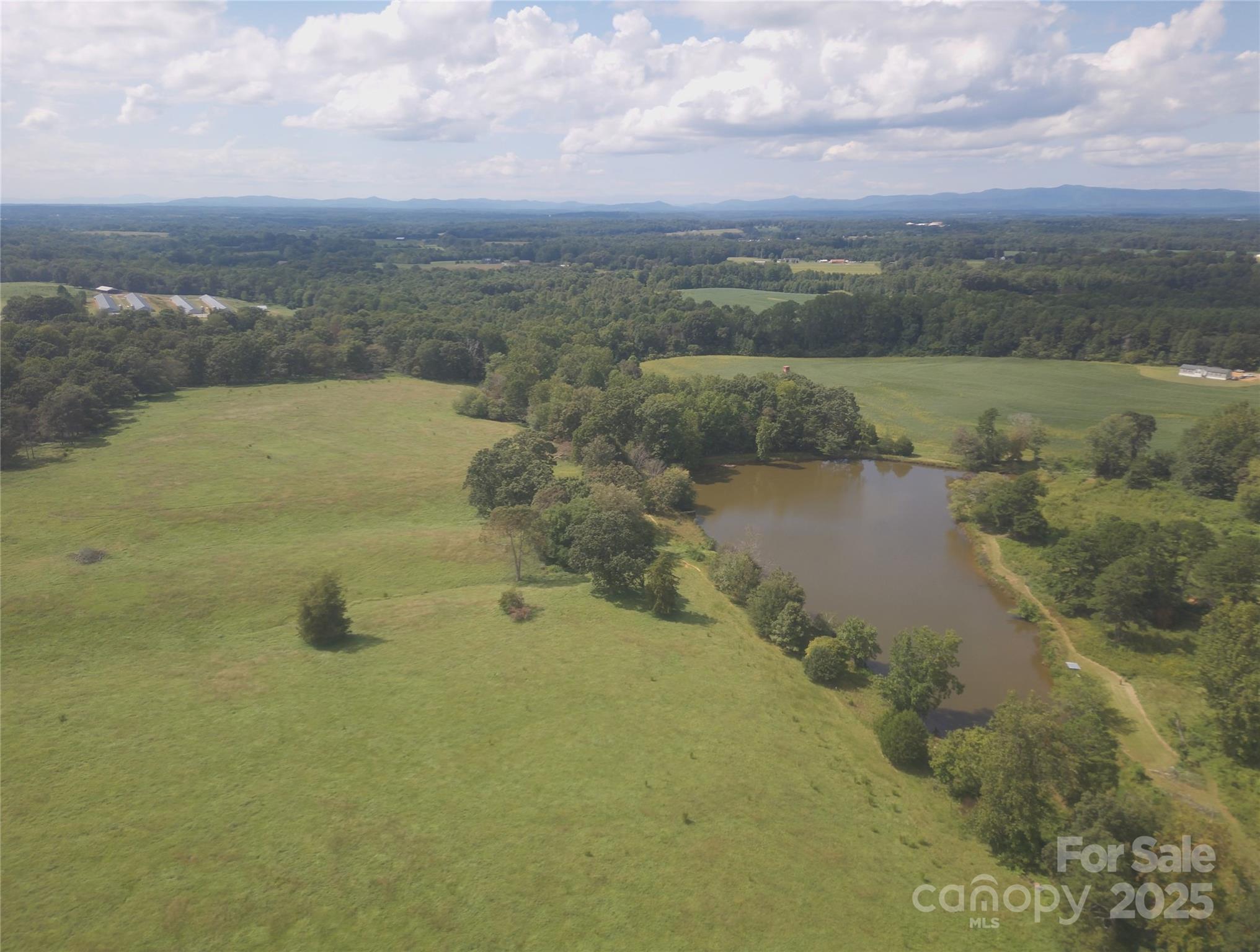 0 Ed Hamrick Road Shelby, NC 28150 - Photo 3 of 8 a view of a lake with a city