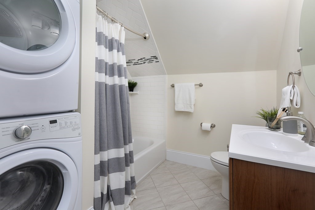 150 Lowell Street, Unit 3 Somerville, MA 02143 - Photo 11 of 12 a bathroom with a sink a toilet and a mirror