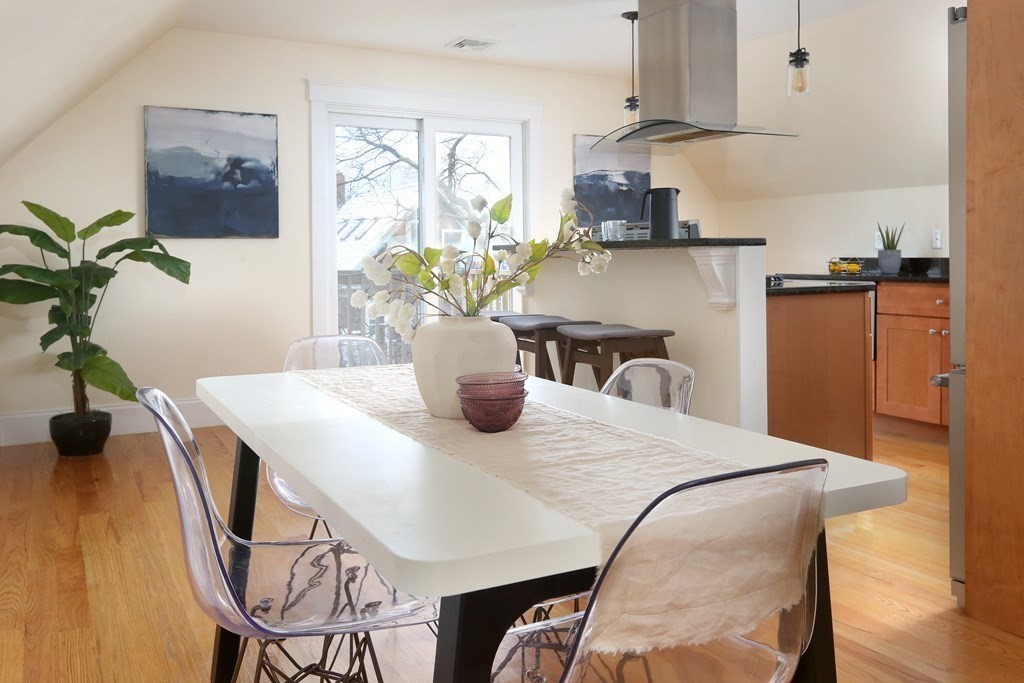 150 Lowell Street, Unit 3 Somerville, MA 02143 - Photo 5 of 12 a view of a dining room with furniture and a potted plant
