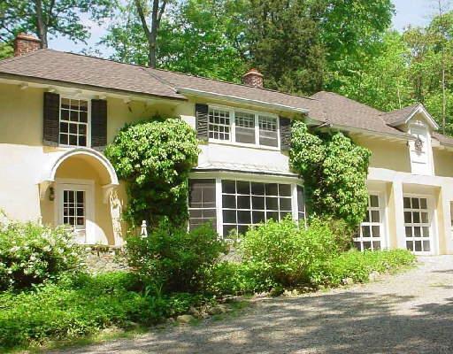 107 Sharp Hill Road Wilton, CT 06897 - Photo 1 of 1 a front view of a house with garden