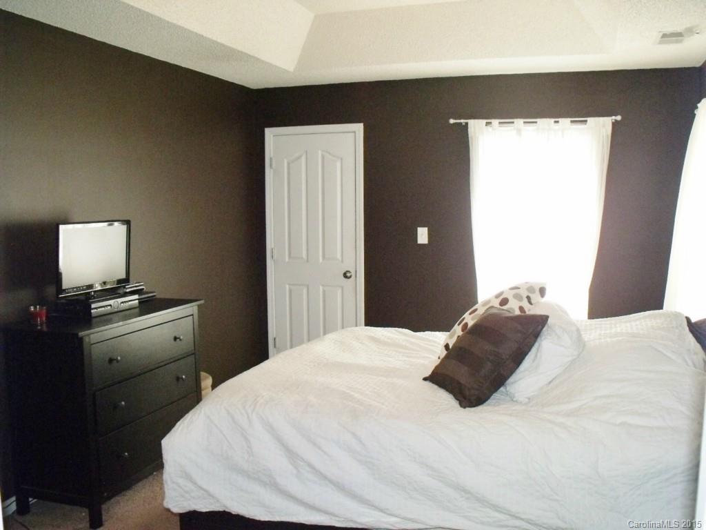 15210 Tracy Beth Road Huntersville, NC 28078 - Photo 13 of 24 a bedroom with a bed and wooden floor