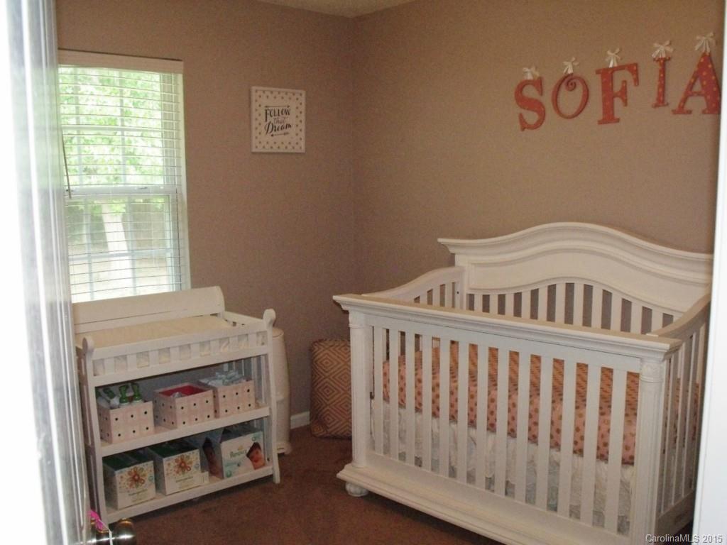 15210 Tracy Beth Road Huntersville, NC 28078 - Photo 16 of 24 a bedroom with a bed and a window